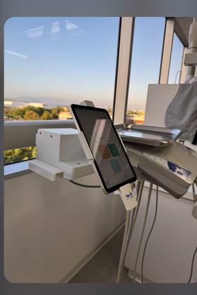 Bien-Air electric delivery unit with iOptima tablet in a dental operatory